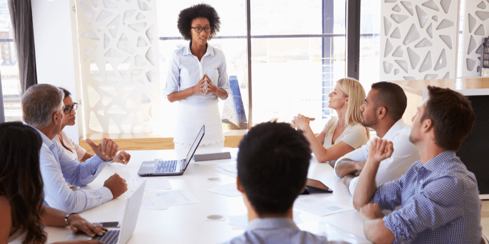 accounting firm business owner leading meeting