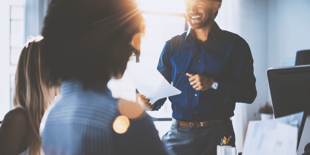 young businessman leading meeting